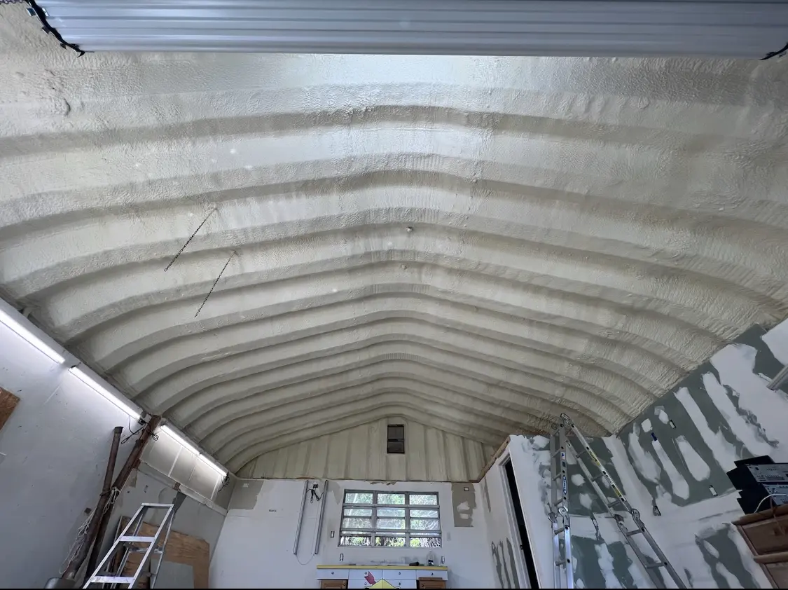 Spray polyurethane foam applied to the underside of a metal roof deck in Fairland